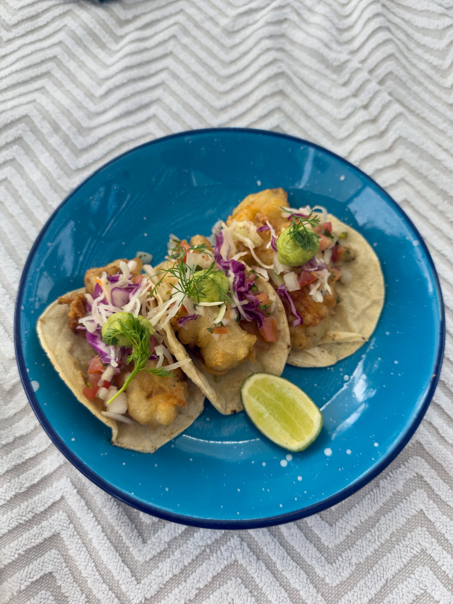 Fried fish tacos served poolside at the Hotel Conrad Tulum Riviera Maya